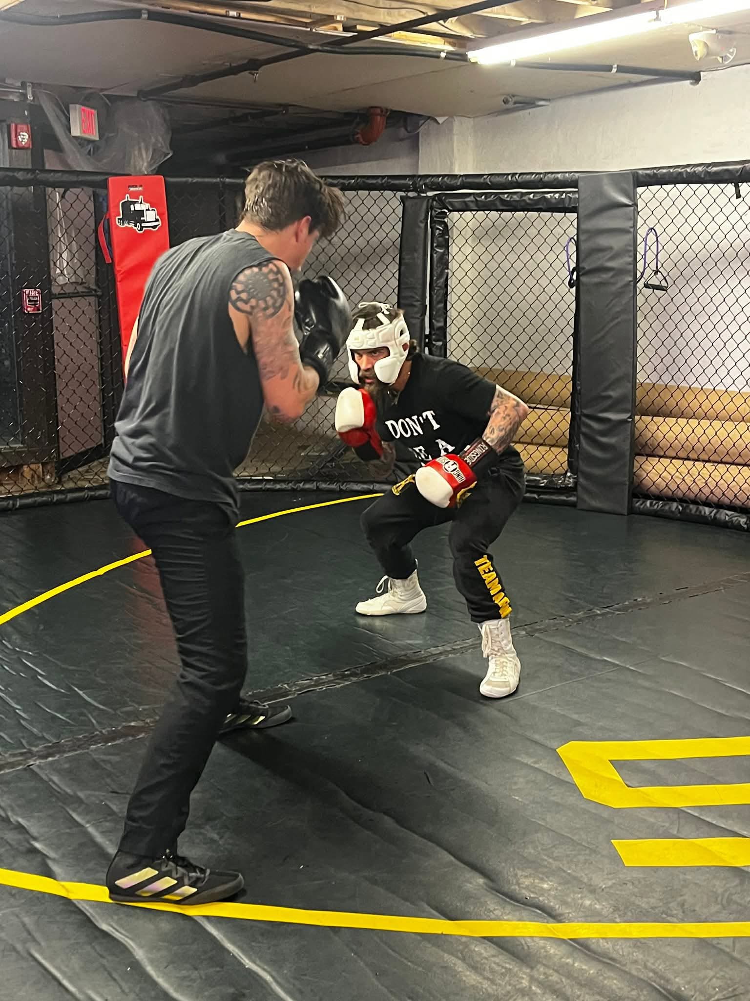 MMA training in cage