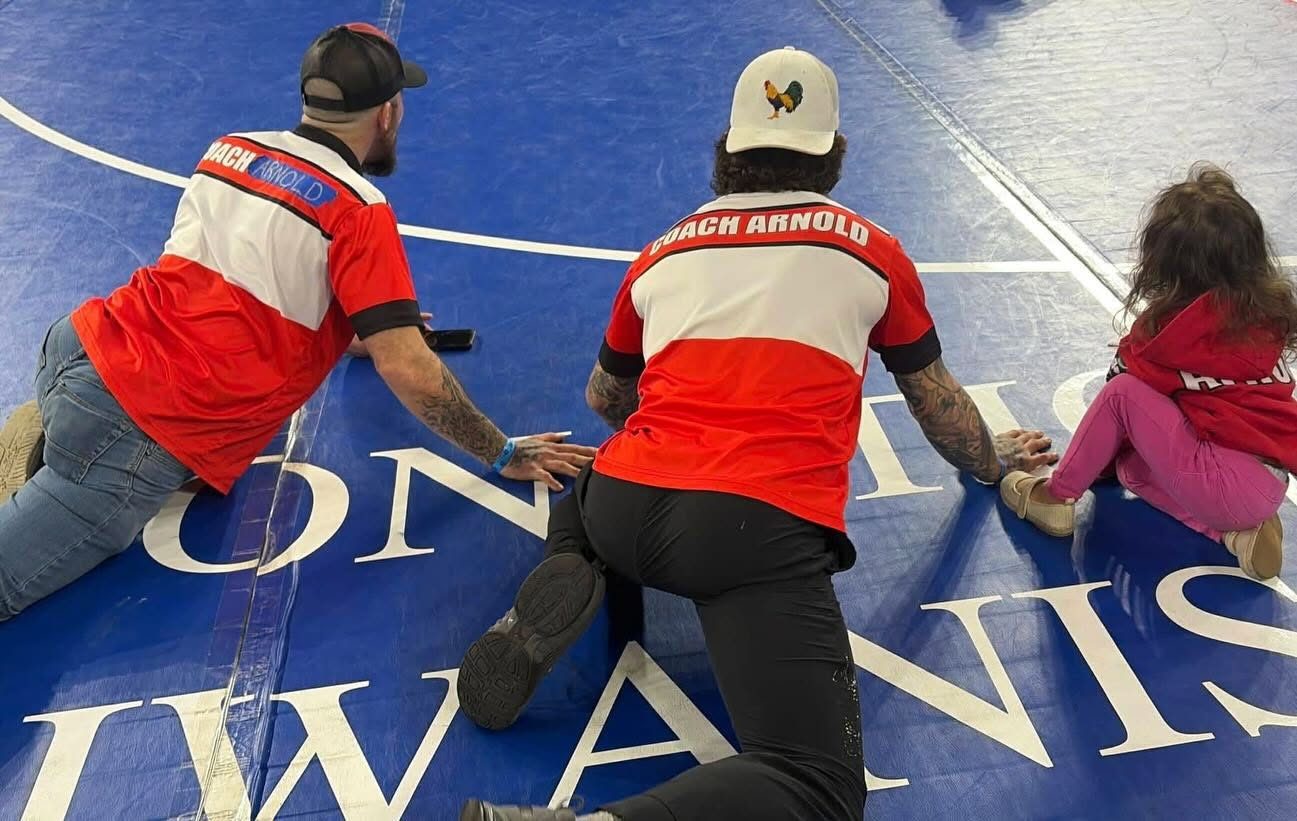 Coaches watching a match