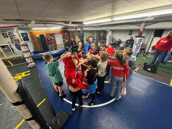 Youth team huddle in the gym